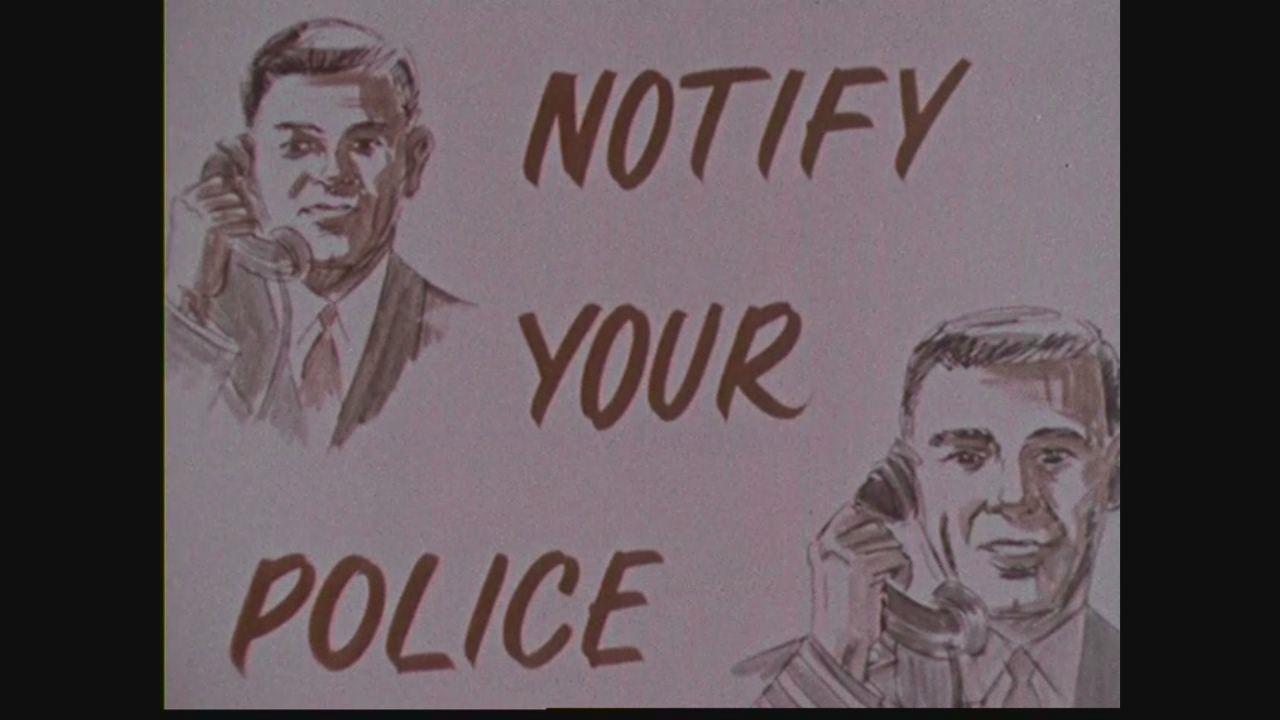 Carton illustré : NOTIFY YOUR POLICE, deux hommes au téléphone